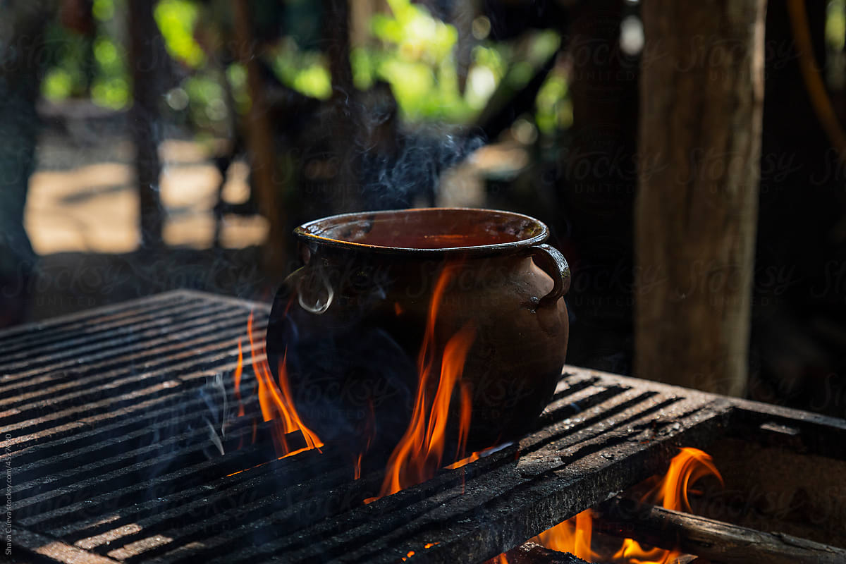 Clay pot on a grill with high heat