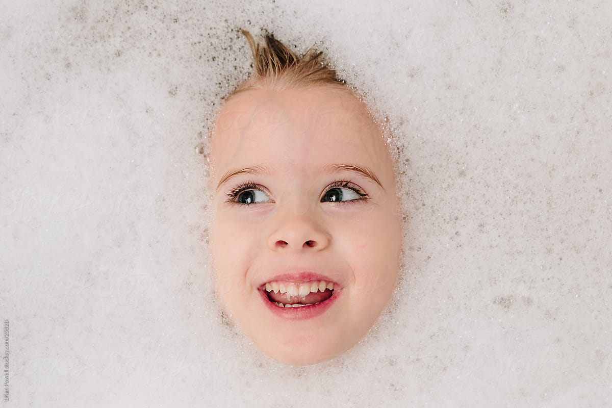 girl washing her hair in bubble bath