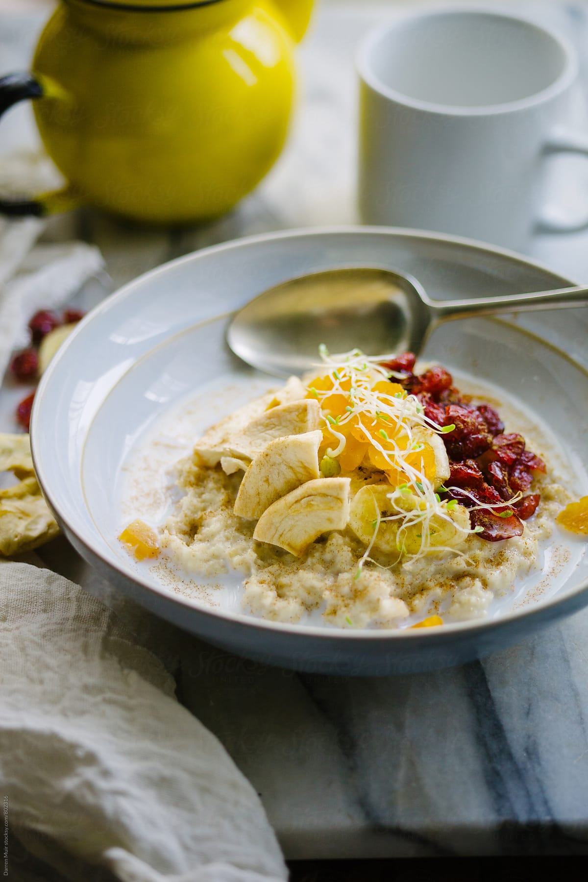 Breakfast: Healthy bowl of oat porridge with dried fruits.