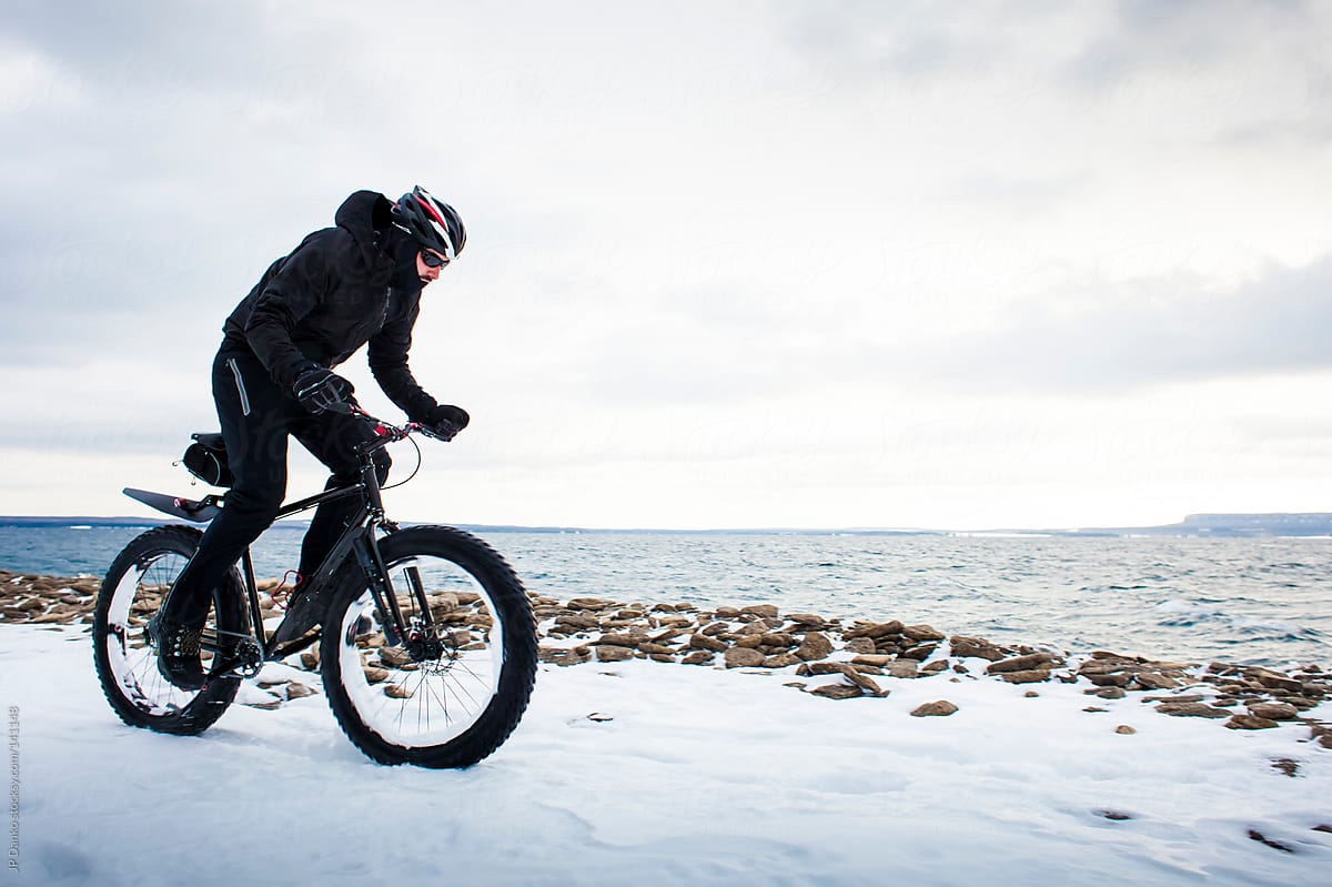 Extreme Sport Winter Mountain Biking  Man Riding Fat Bike In Snow