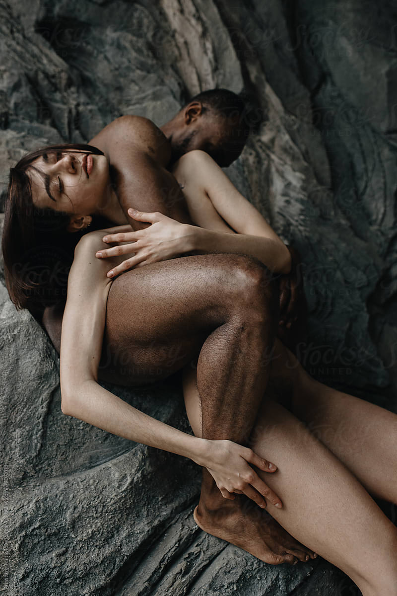 White Woman's Hand Holding Black Man's Leg, Multiethnic Love Couple