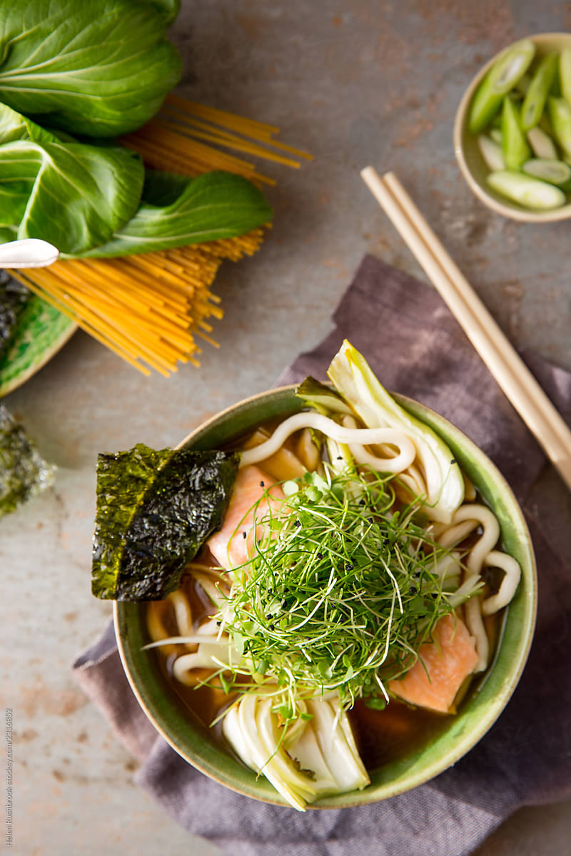 Food photography Miso broth with salmon, noodles and micro greens