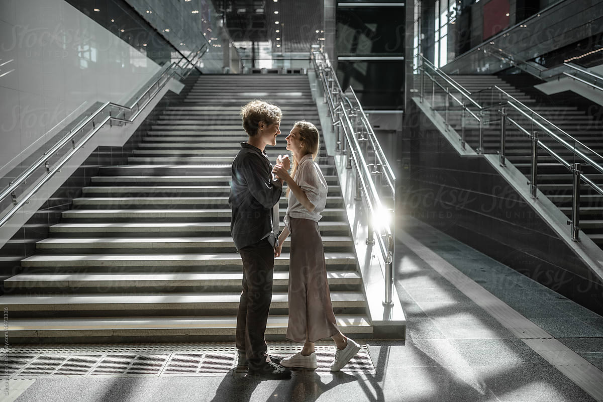 a couple in love on the background of the stairs