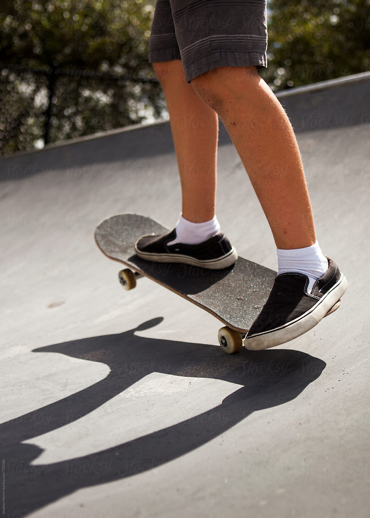 Feet of Skateboarder on Ramp
