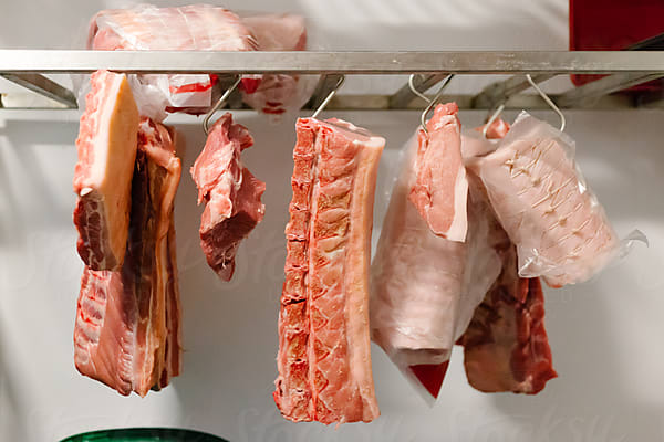 Joint Of Meat On Butcher's Hook Scale by Stocksy Contributor Kirsty Begg  - Stocksy