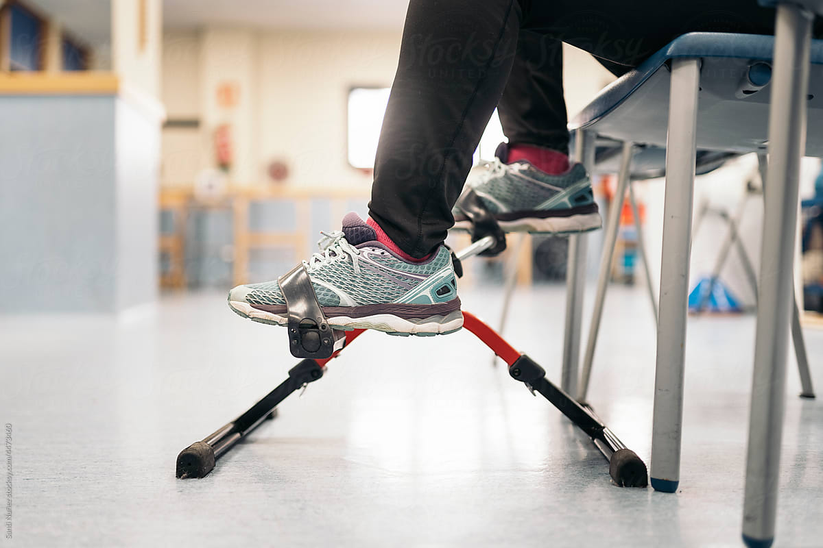 Patient spinning pedals during rehabilitation session