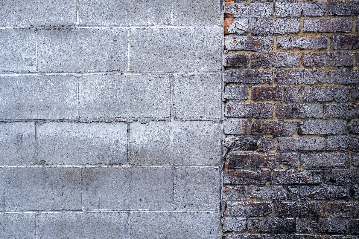 Stock image of old brick wall covered in metallic spray paint