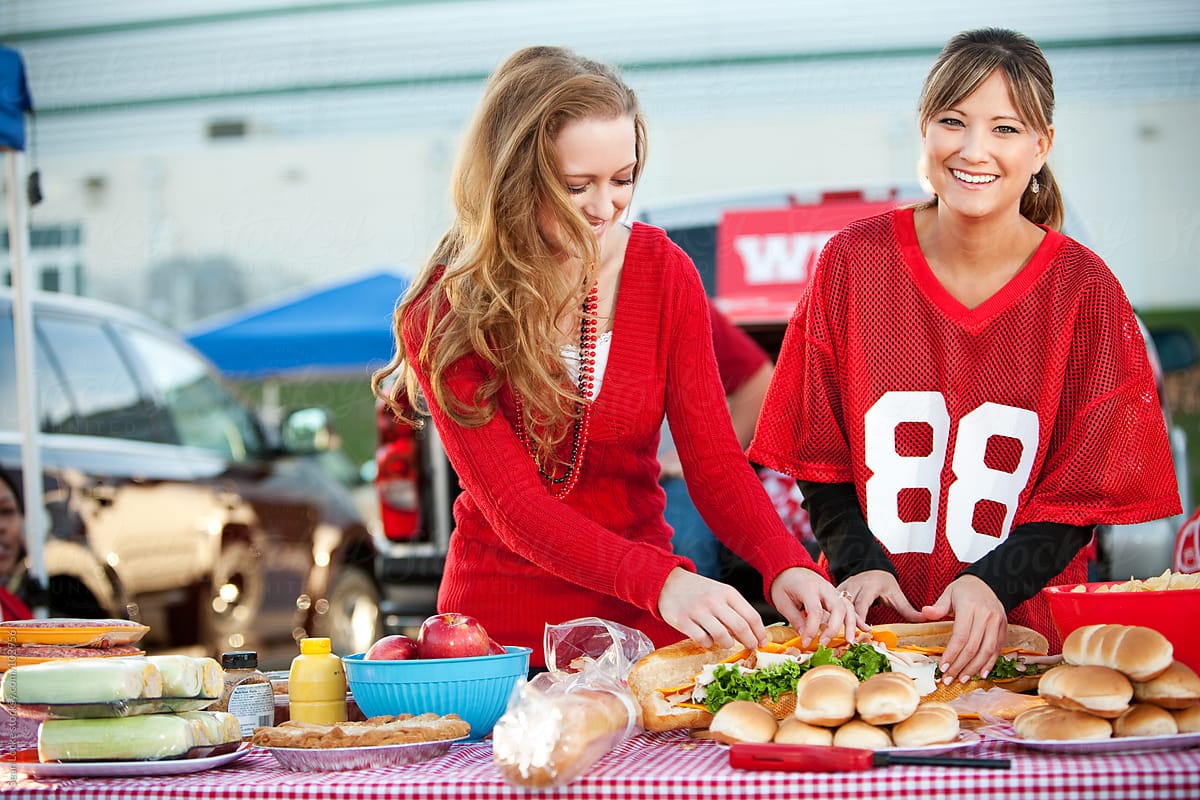 Tailgating: Laughing Woman at Food Table
