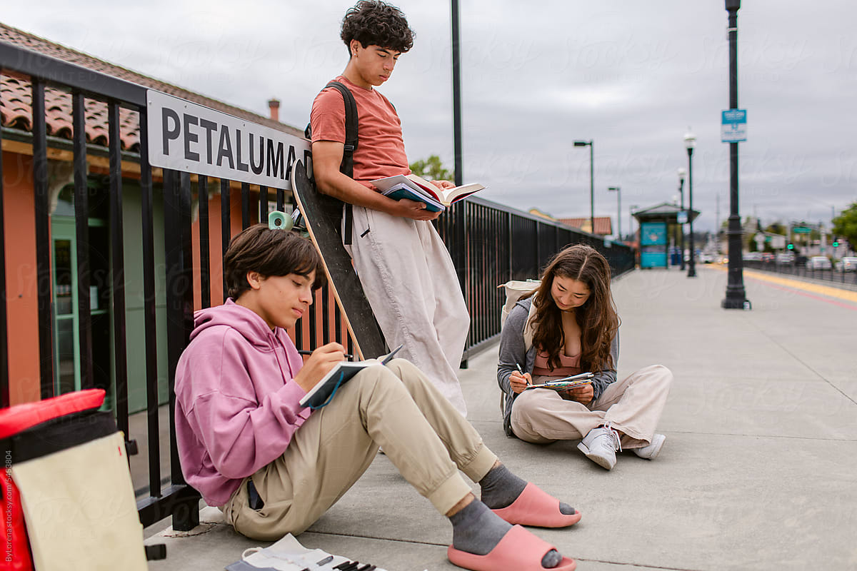Teen studens waiting for the train at station