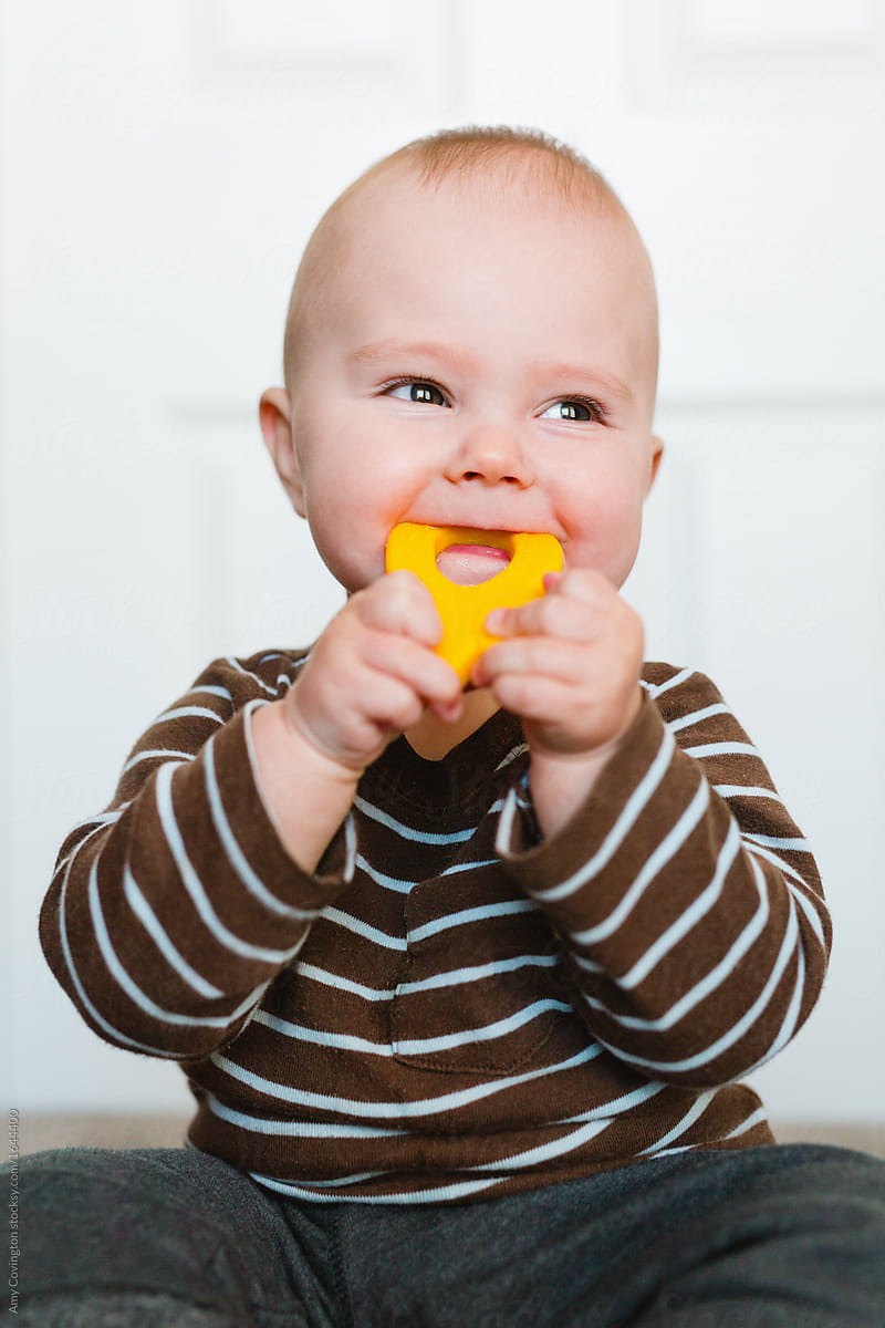 Portrait of a teething baby boy