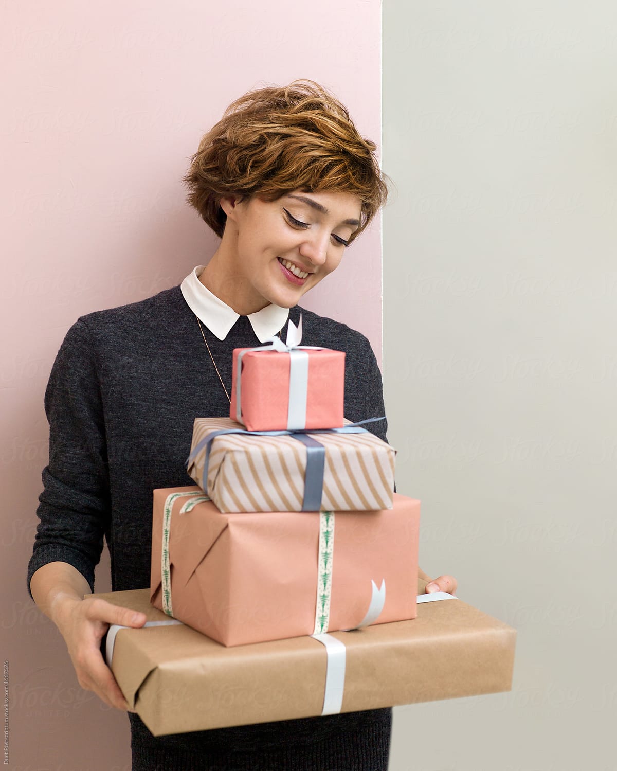 Attractive woman with gift boxes