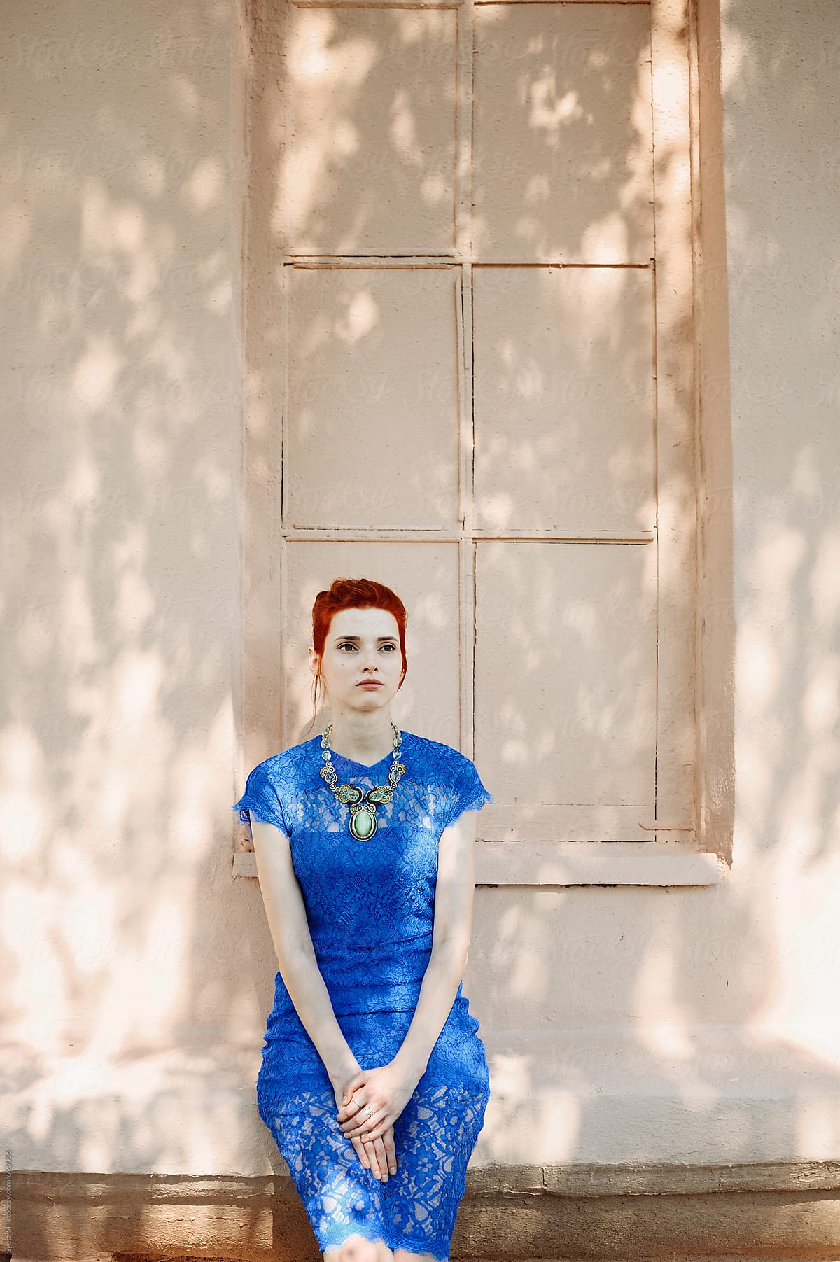 Red-haired girl in a blue dress