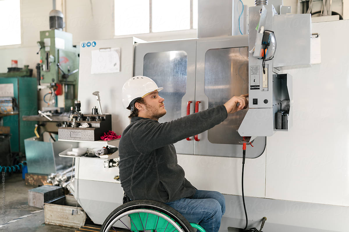 Disabled Worker Working With A Machine