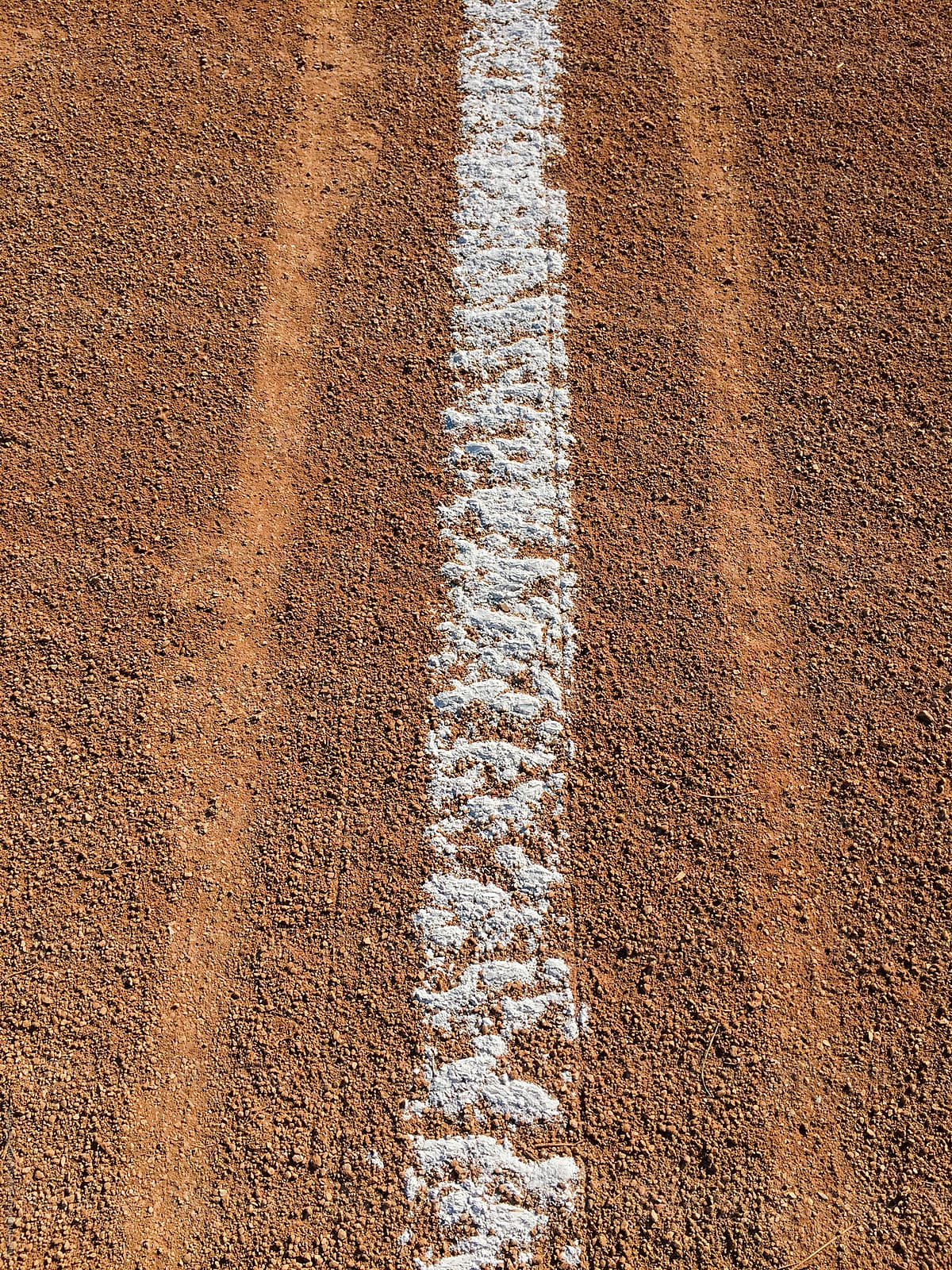 Close up of white boundary marks on baseball field