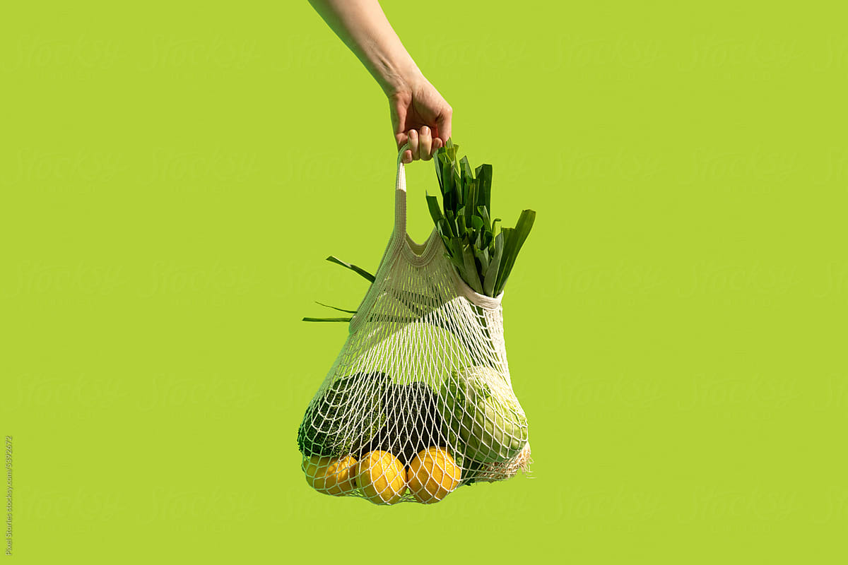 Reusable string bag with vegetables. Sustainable healthy shopping