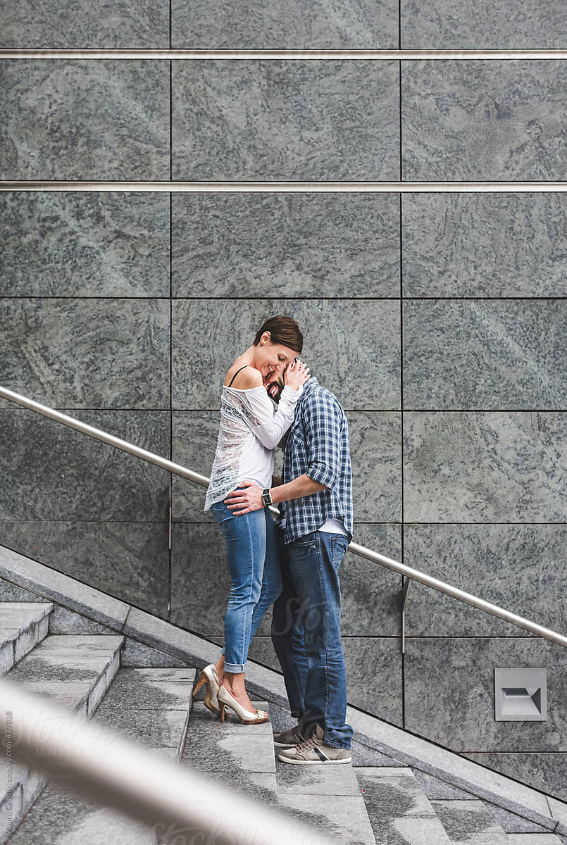 Happy Couple Kissing by Stocksy Contributor Mauro Grigollo