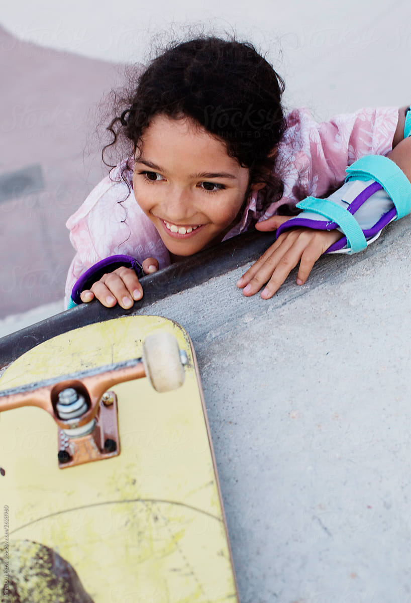 Portrait of a cute girl-skateboarder