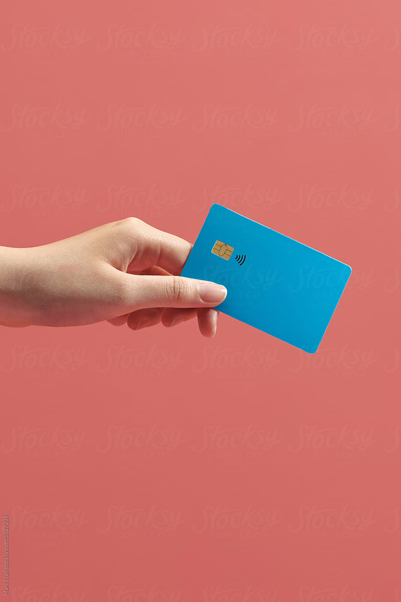 female hand holding credit card