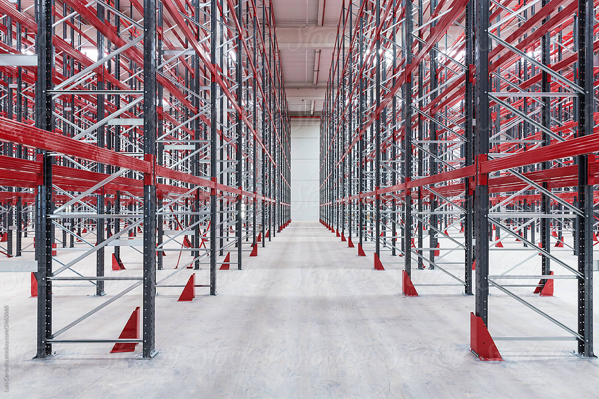 Empty shelves into an industrial warehouse