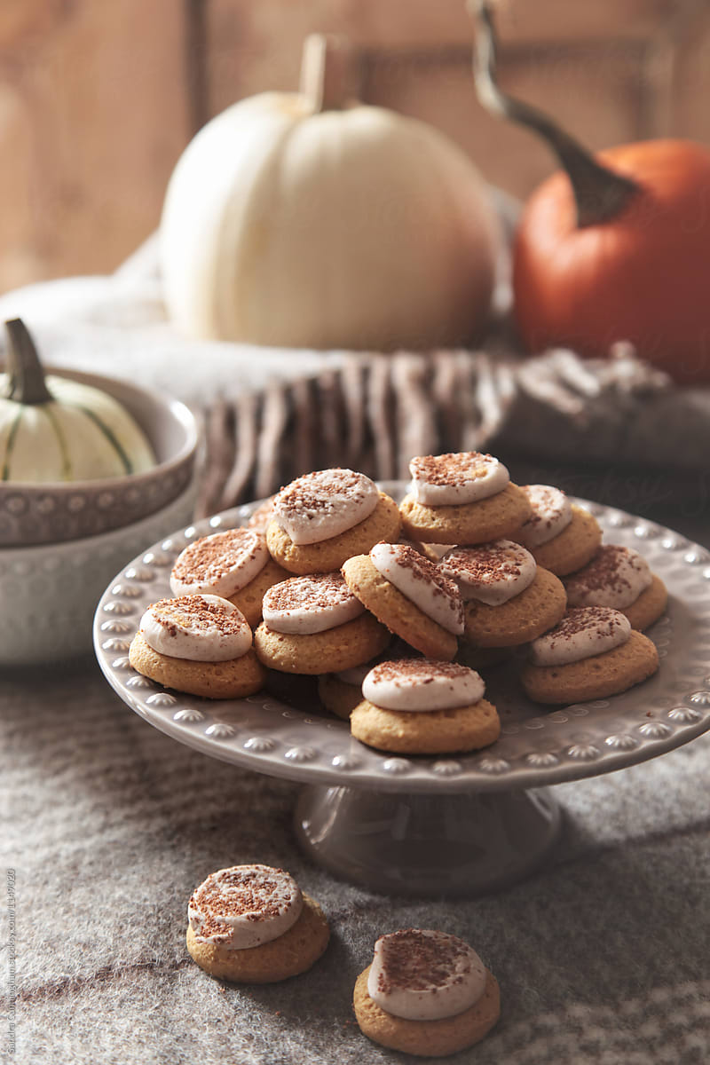 Close up of pumpkins cookies on cake stand for Thanksgiving