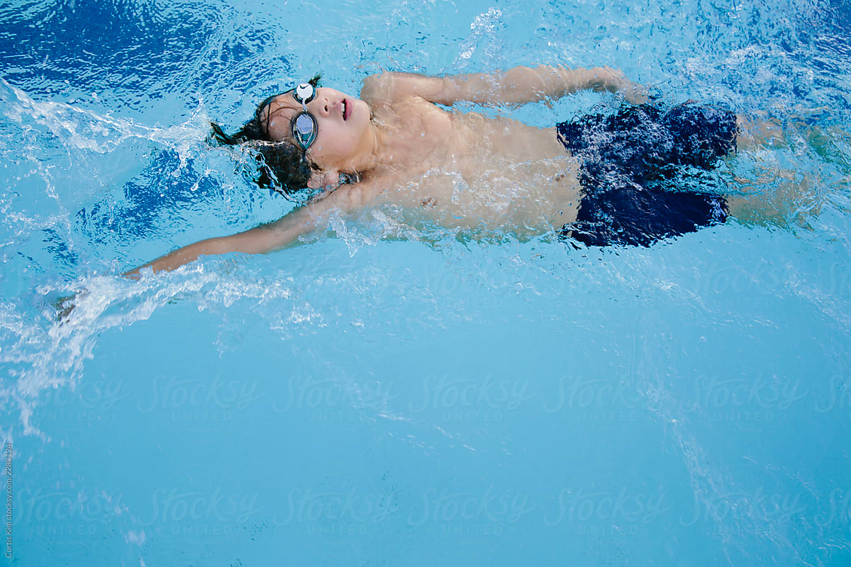 Swimmer practicing his backstroke technique