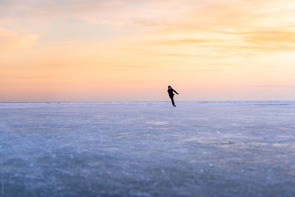 Ice Skating on Frozen Lake in Winter Natural Rink