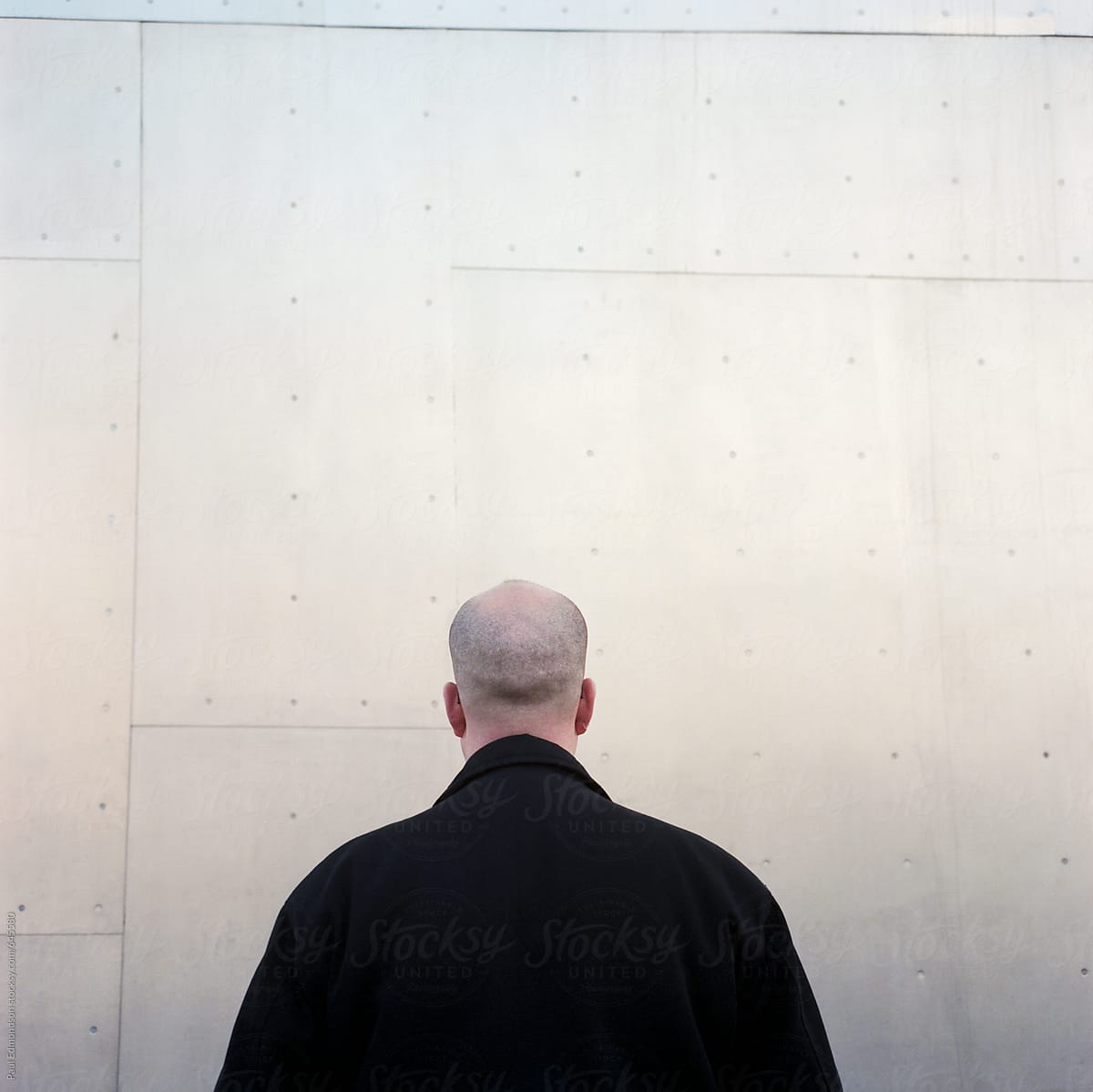 Portrait of bald man, facing away from camera