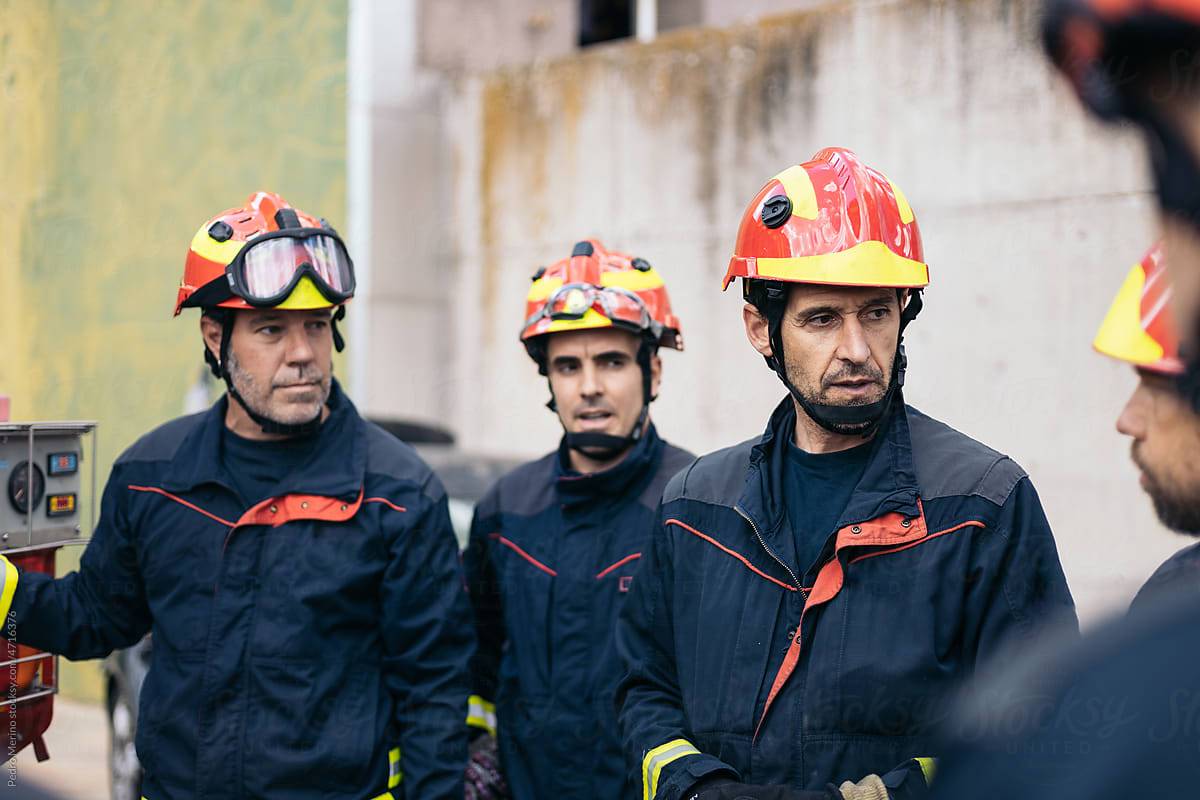 Firefighters meeting while working