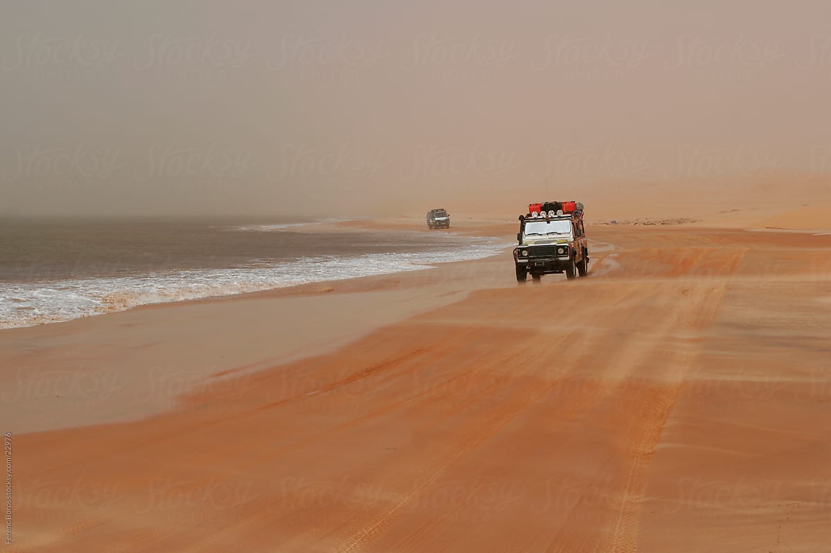 Cars between the desert and the ocean