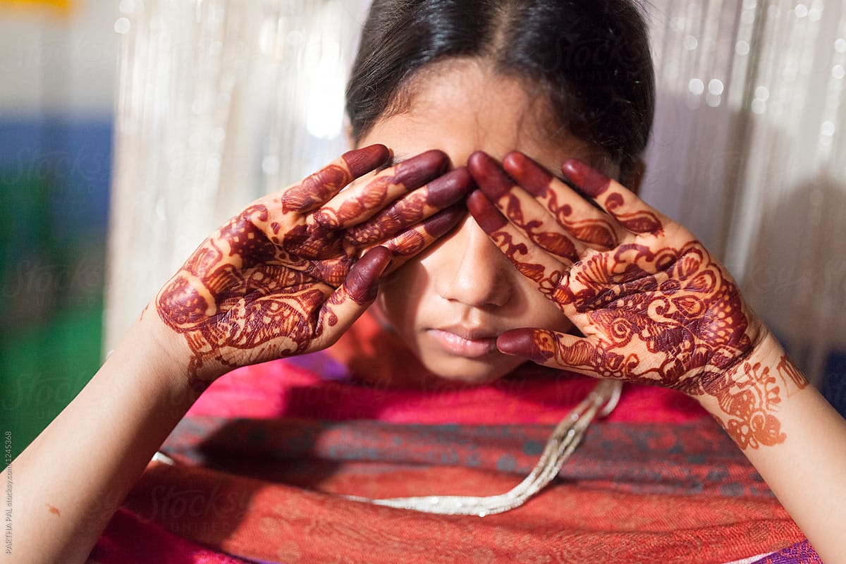 Teenage Girl Hiding Face With Hand Decorated With Mehendi By Stocksy