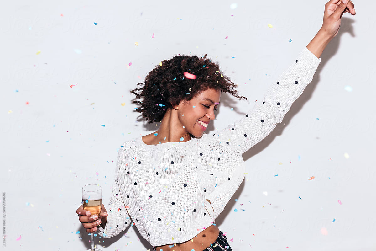 Mixed race woman celebrating a party