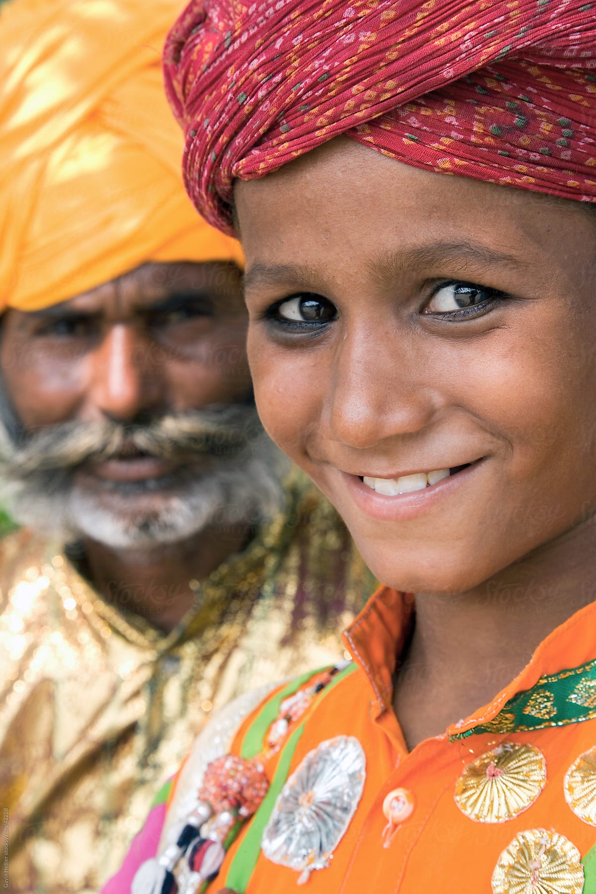 India, Rajasthan, Jaipur, portrait of a local boy and his father wearing colourful turbans