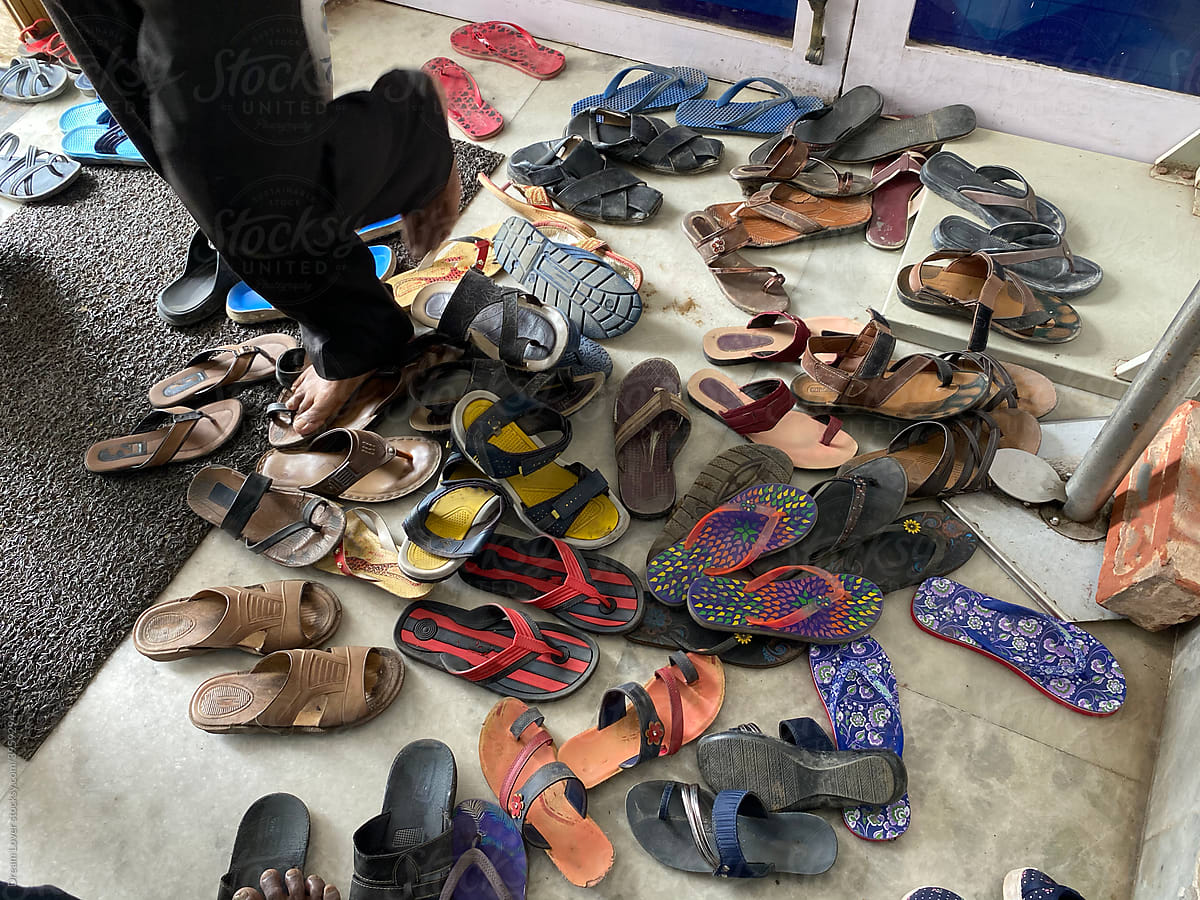 Shoes are scattered outside a clinic in covid situation