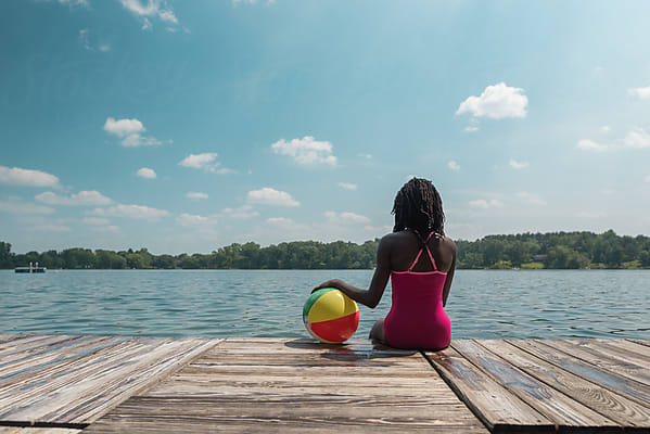 Standing African American Girl In Swimming Suit Fishing By A Lake by  Stocksy Contributor Gabi Bucataru - Stocksy