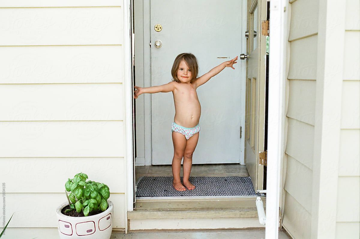 Little Girl Stand In Doorway In Underwear by Stocksy Contributor