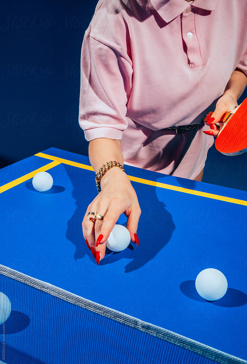 Hand picking ping pong ball