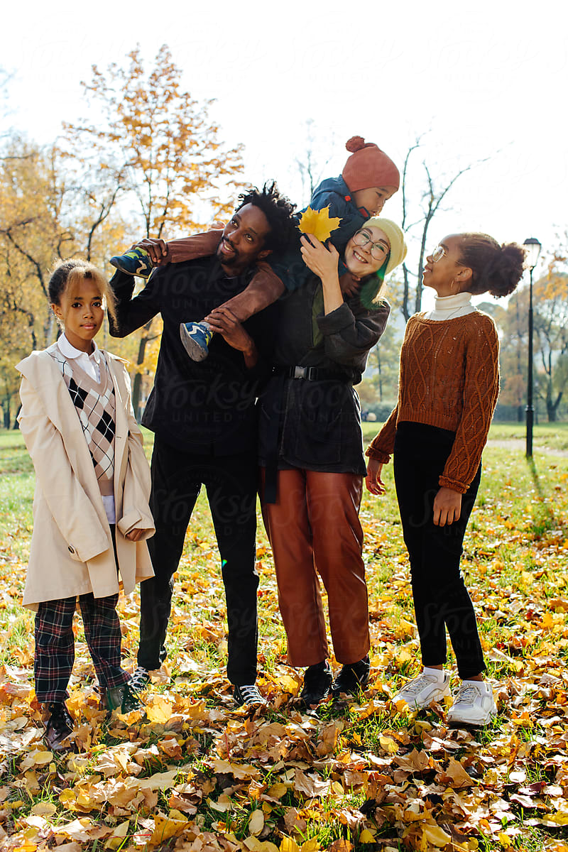 Multiracial family in autumn park