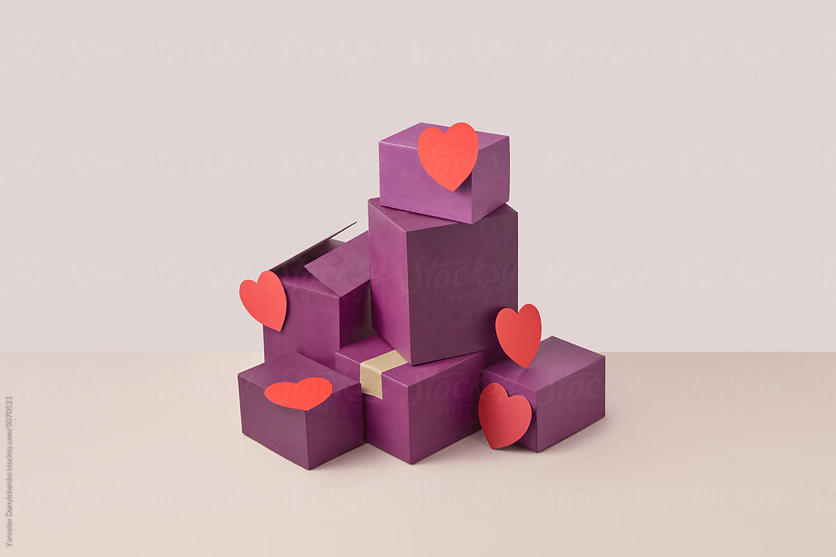 Purple cardboard boxes pile decorated with red paper craft hearts