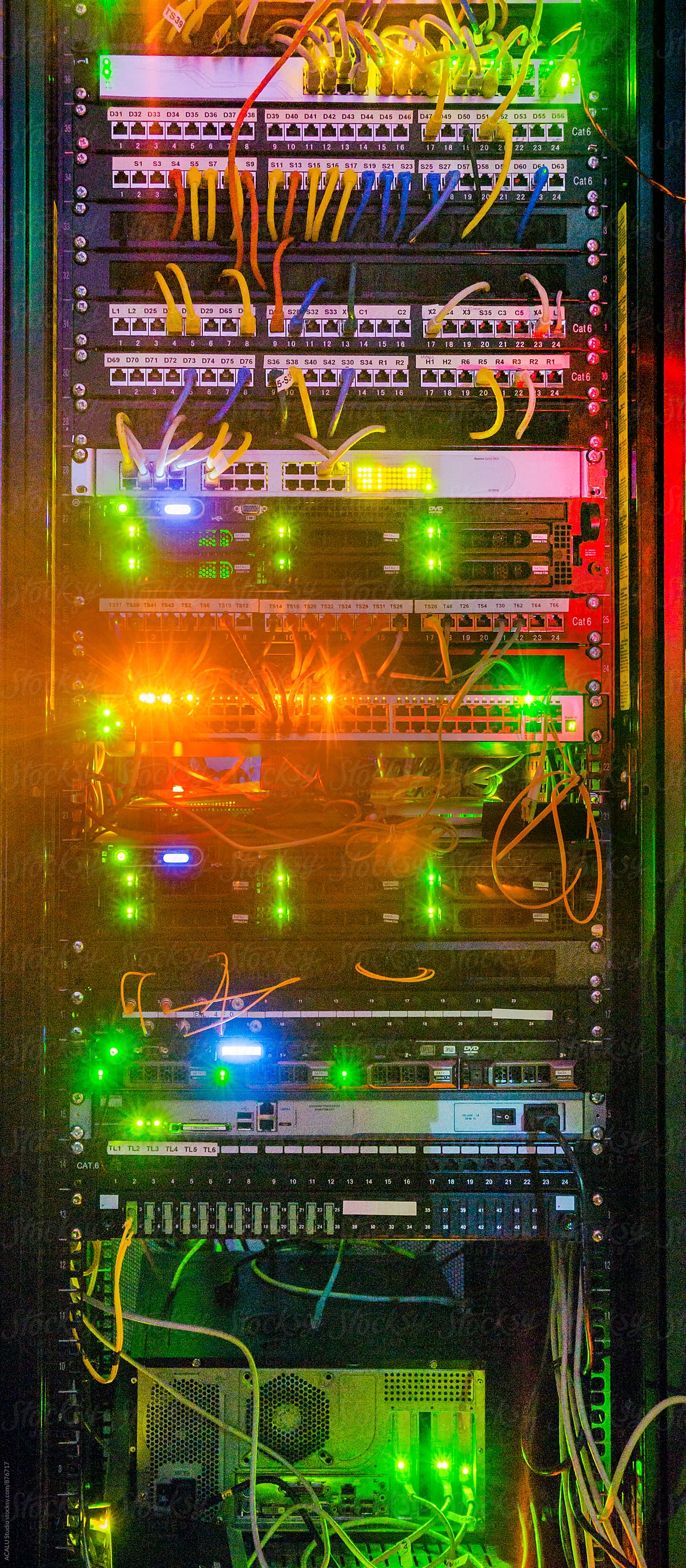 Illuminated telecommunications rack with switches and patch panels