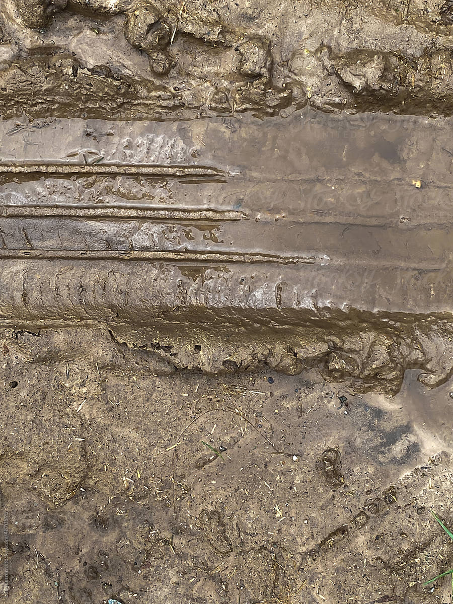 car tracks on muddy road texture