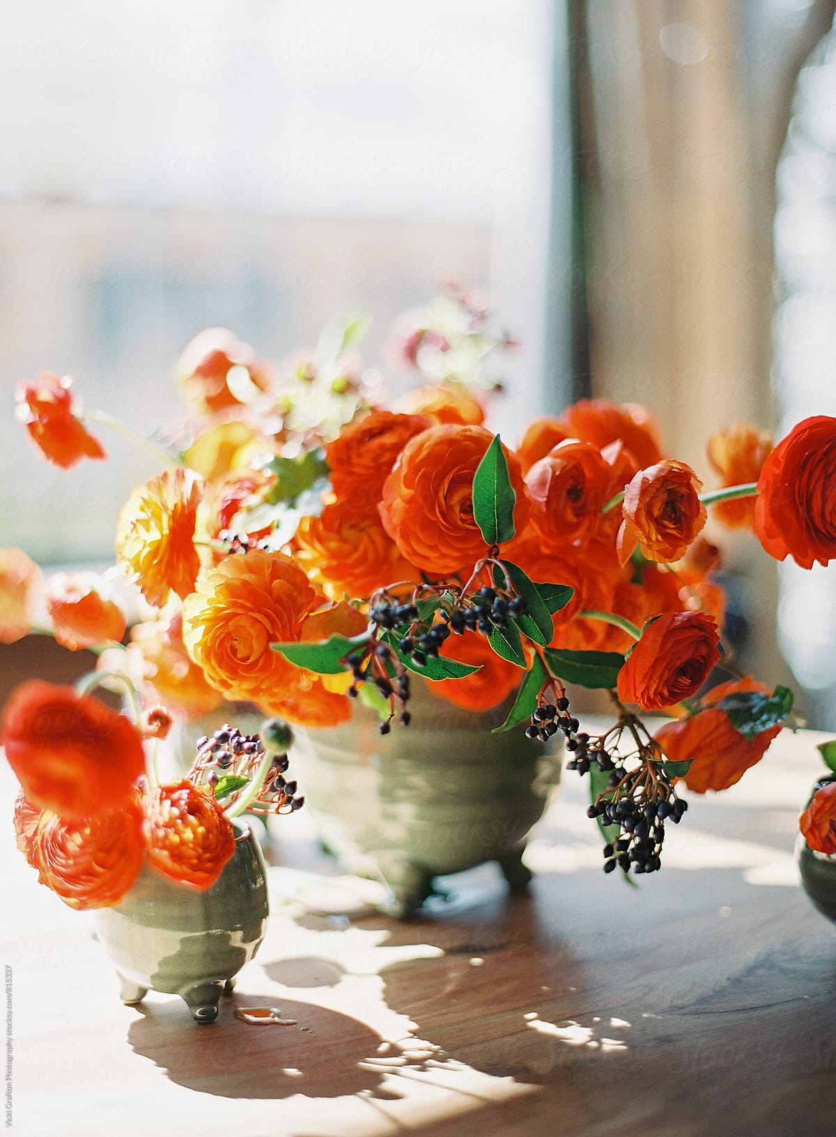 Orange Floral Arrangement On Table by Stocksy Contributor Vicki Grafton  Photography - Stocksy