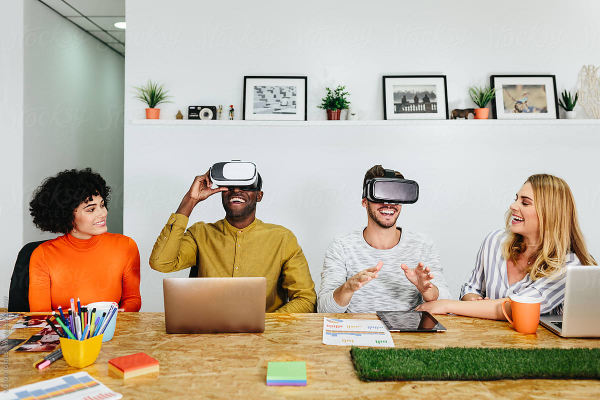 Cheerful men in VR glasses coworking