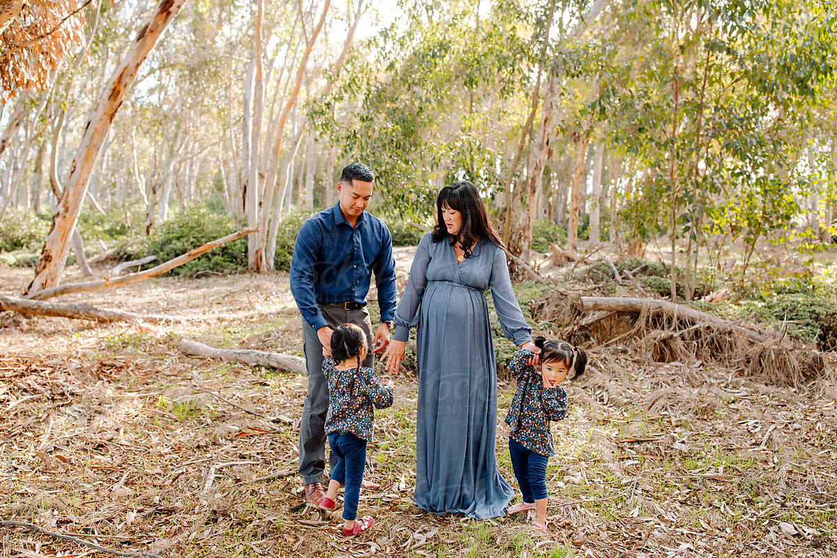 Young family in eucalyptus grove