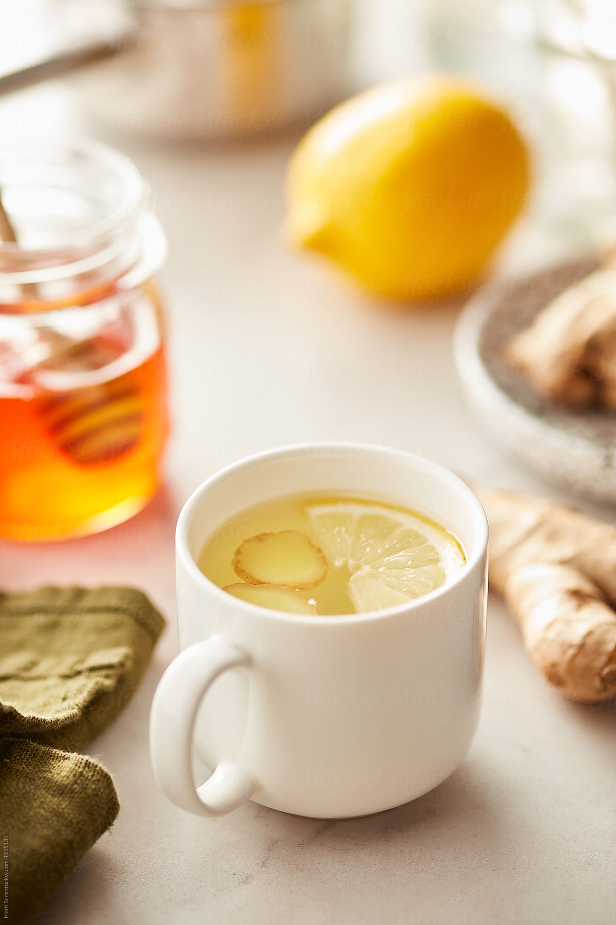 Cup of delicious honey lemon tea with ginger.