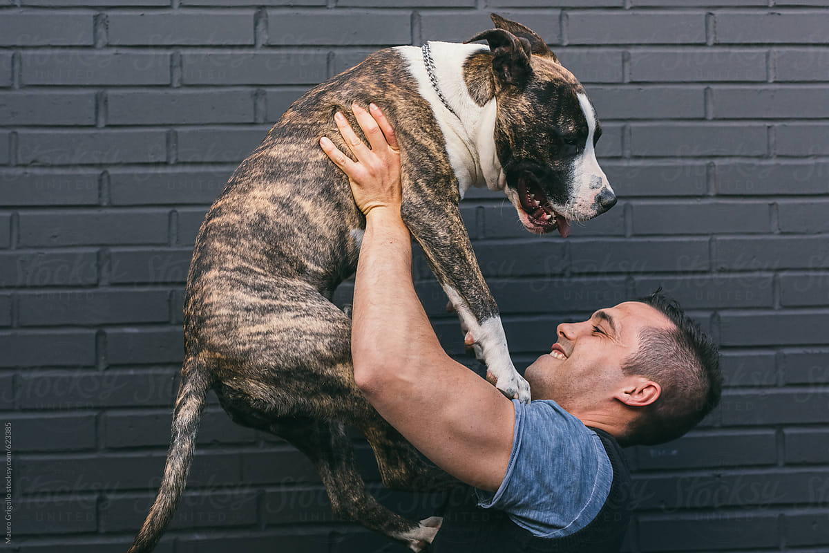 Man embracing his Dog