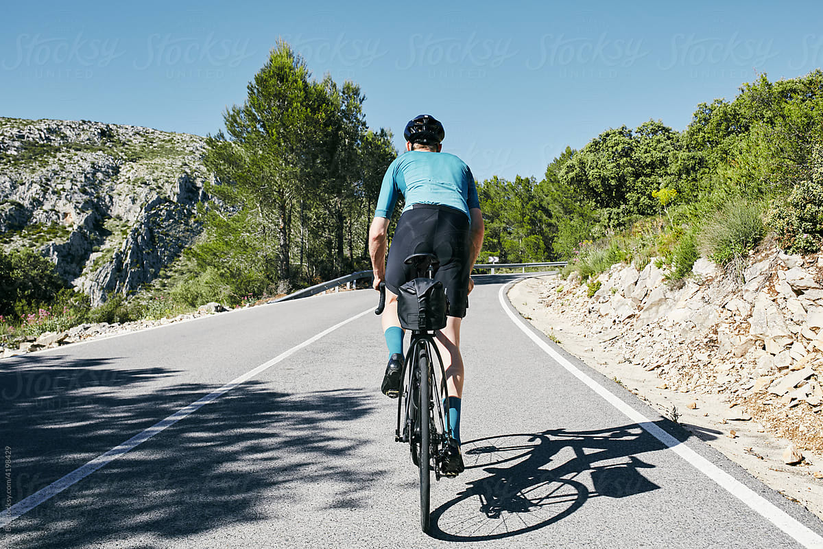 Racing cyclist climbs European hill