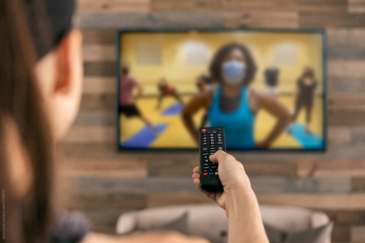 Home: Woman Uses Remote To Set Up Livestream Workout Class