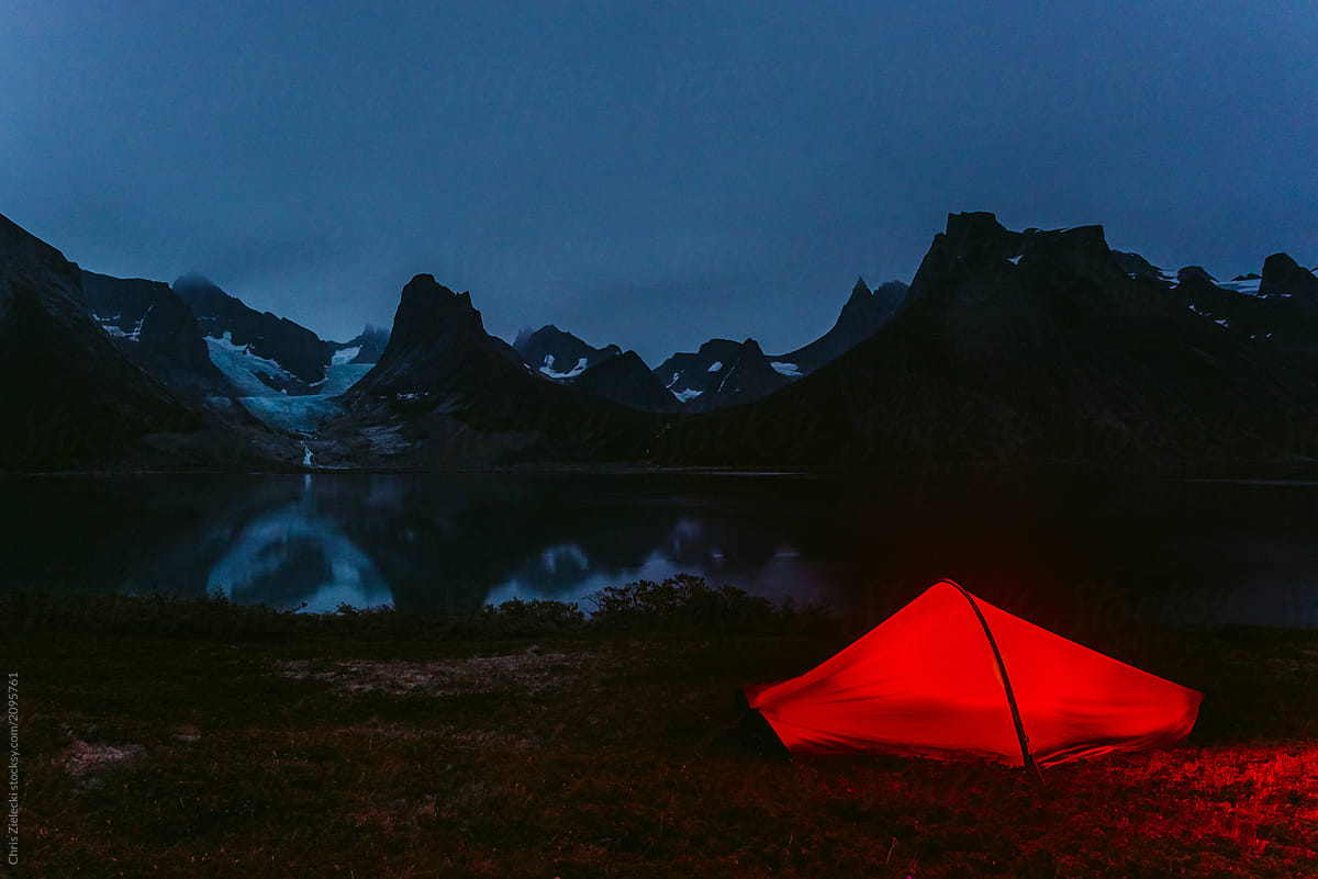 Tourist camping tent on dark coast