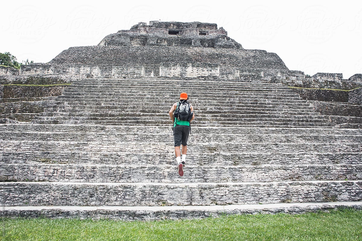 Man Climbing Ancient Mayan Steps
