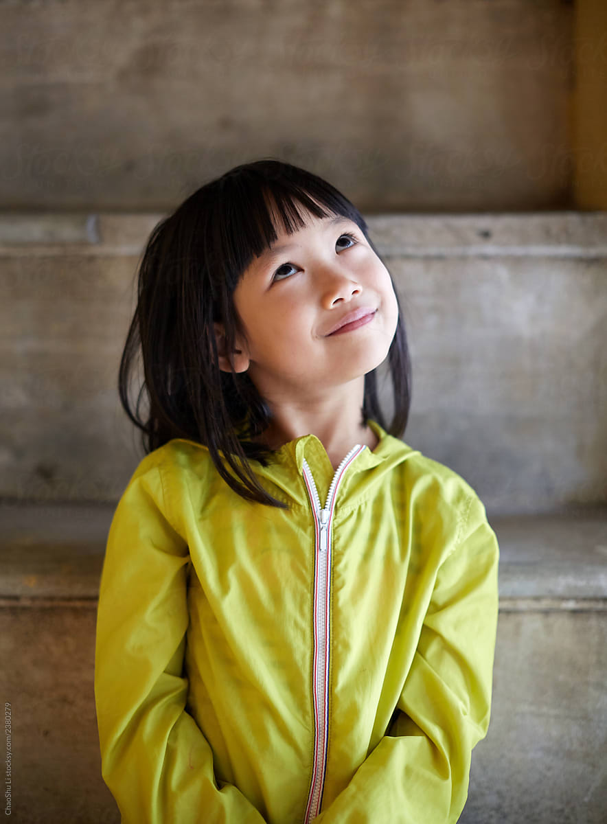 cute-asian-little-girl-on-the-quaint-stone-steps-travel-in-hanoi-by